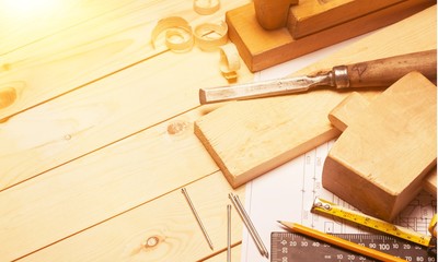 Carpentry tools with wooden planks and Blueprint.