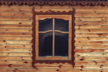 Window in a wooden house