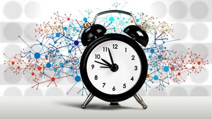 Retro alarm clock on blurred background
