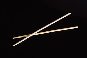 Fototapeta premium Chopsticks on a black background..Traditional Japanese cuisine