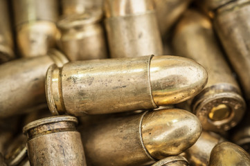 Top close-up macro view of large group of gun bullets