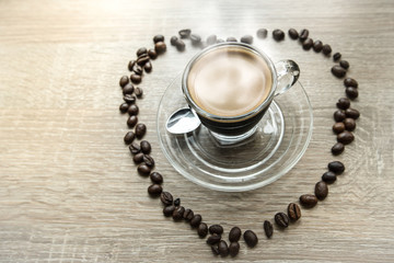 cup of coffee on wooden table
