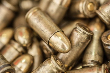 Top close-up macro view of large group of gun bullets