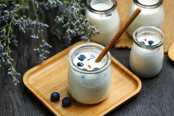 blueberry fruit smoothie or milk shake or yogurt in glass bottle