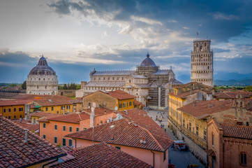 Sunset aerial view of Pisa historic center with famous leaning tower and Duomo di Pisa cathedral....