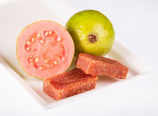 Guava fruit and paste on a white square plate - White background
