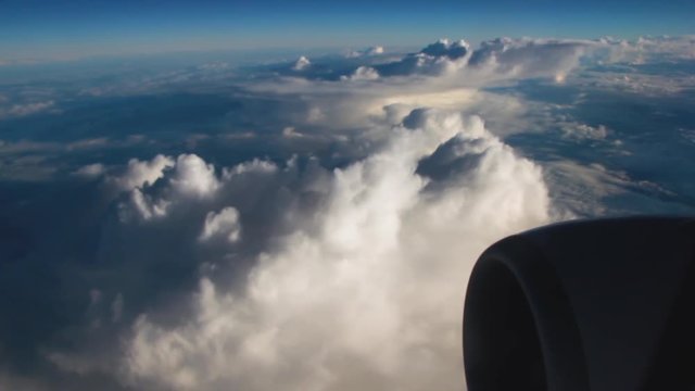 Airplane Interior View of Clouds Through Jet Window