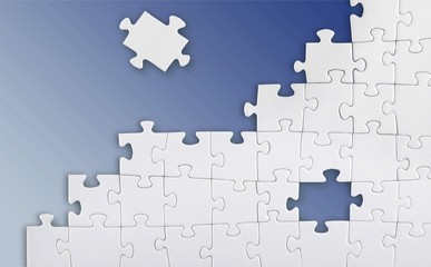 White puzzle pieces on grey background