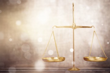 Law scales on table background. Symbol of justice