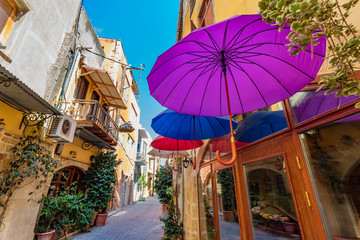 Obraz premium Colorfull Umbrellas hanging over the street in Chania, Greece