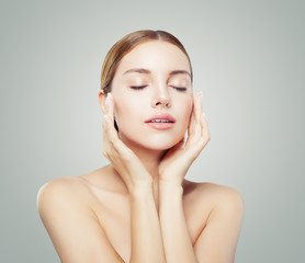Pretty woman with closed eyes  and young healthy skin. Facial treatment, face lifting, anti aging...