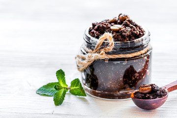 Spa concept with natural coffee scrub on white background