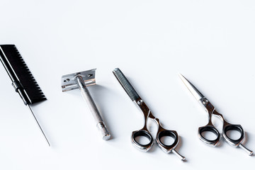 white desktop with tools for shaving beards