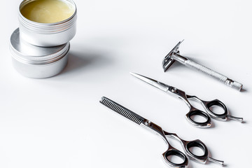 white desktop with tools for shaving beards