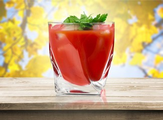 Glass of alcohol cocktail on white background, bloody Mary.
