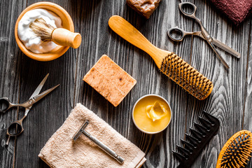 Tools for cutting beard barbershop top view on wooden background