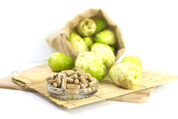 Noni powder capsule  with noni fruit .Horizontal 