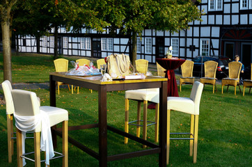 Set table with chairs in the garden of a farmhouse