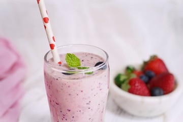 Homemade Strawberry blueberry Smoothie in a tall glass, selective focus