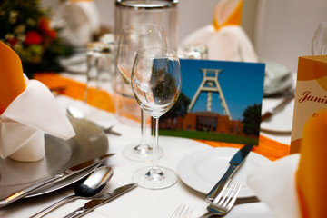 elegant table setting at a wedding with glasses and plates
