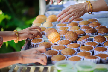 Volunteer food servers dish out a free charity : concept of helping