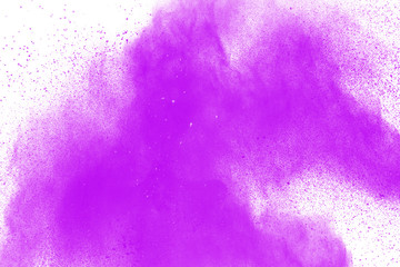 Abstract purple powder explosion on white  background. Freeze motion of purple dust particle...