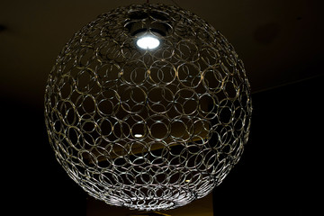 Modern chandelier in form of sphere in black