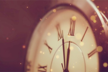 Obraz na płótnie Canvas Close-up photo of vintage clock on background