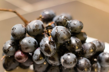 Purple grape on the plate