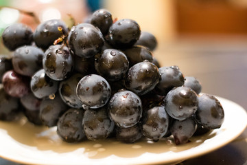 Purple grape on the plate