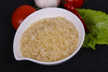 Raw uncooked rice in the bowl