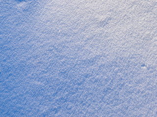 Natural winter background with snow drifts and falling snow
