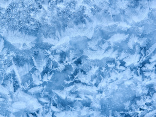 snow background. Abstraction texture of blue ice on a lake.