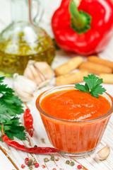 Delicious spicy dip sauce ( confiture, jam )  made of baked red bell pepper, tomatoes, garlic, spices and olive oil. Dressing for gourmets. Selective focus