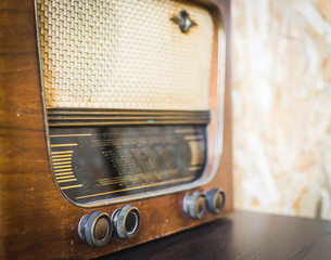 Close up on old vintage radio on hardwood
