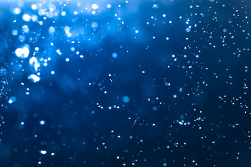 Abstract Blue bokeh defocus glitter blur background.