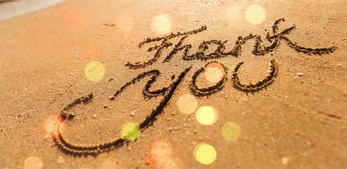 Thank you inscription on sandy sea beach