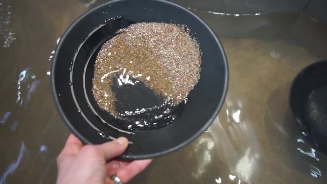 Home education. Adaptation of life to the conditions of the virus covid 19. Remote education. Search for gold through sand washing.
