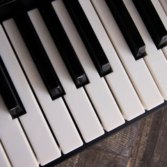 The white and black keys of a synthesizer