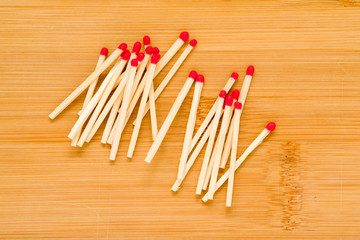 pile of matches on a wooden table