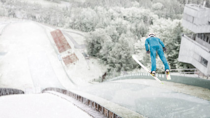 Ski jumper flying through the air during a practice session at the Lake Placid, NY, ski jumps - obrazy, fototapety, plakaty