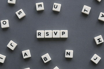 RSVP word made of square letter word on grey background.