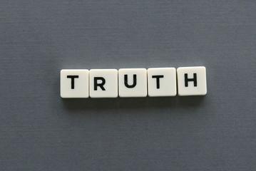 Truth word made of square letter word on grey background.