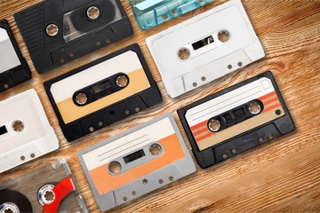 Collection of retro audio tapes on background