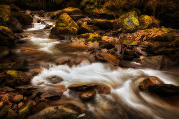 The rocky river bed at Melincourt Brook in Resolven, South Wales, UK