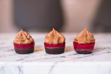 Mini creamy cake with chocolate and raspberry