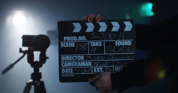 Production crew cueing the team to start camera roll