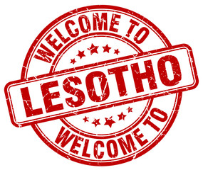 welcome to Lesotho red round vintage stamp