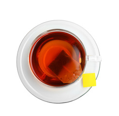 Hot tea in glass cup on white background, top view
