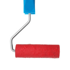 Roller brush with red paint on white background